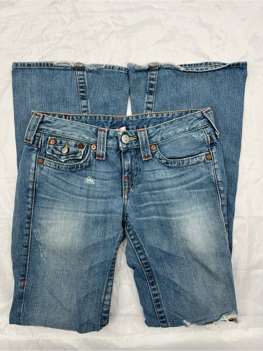 J079 True Religion Joey flare jeans featuring a medium wash denim